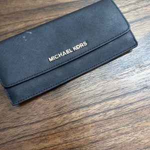 Black king slim Michael Kira wallet, used.